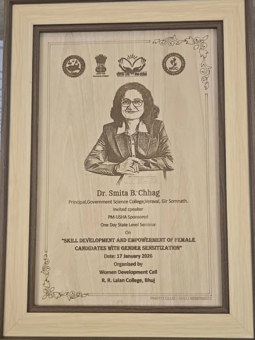 Principal Madam honoured with a memento by the WDC, R. R. Lalan College, Bhuj
